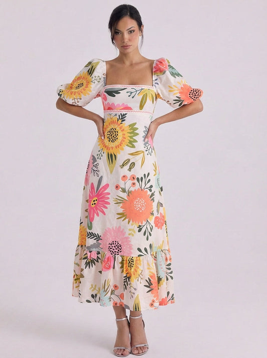 Vestido midi de algodón con estampado floral, manga abullonada y dobladillo con volantes