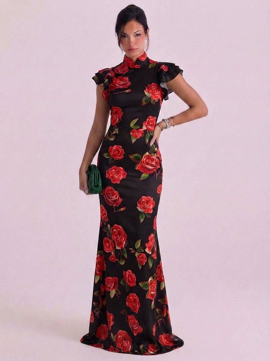 Abito lungo con collo alto e stampa rosa in cotone con maniche ad aletta e volant