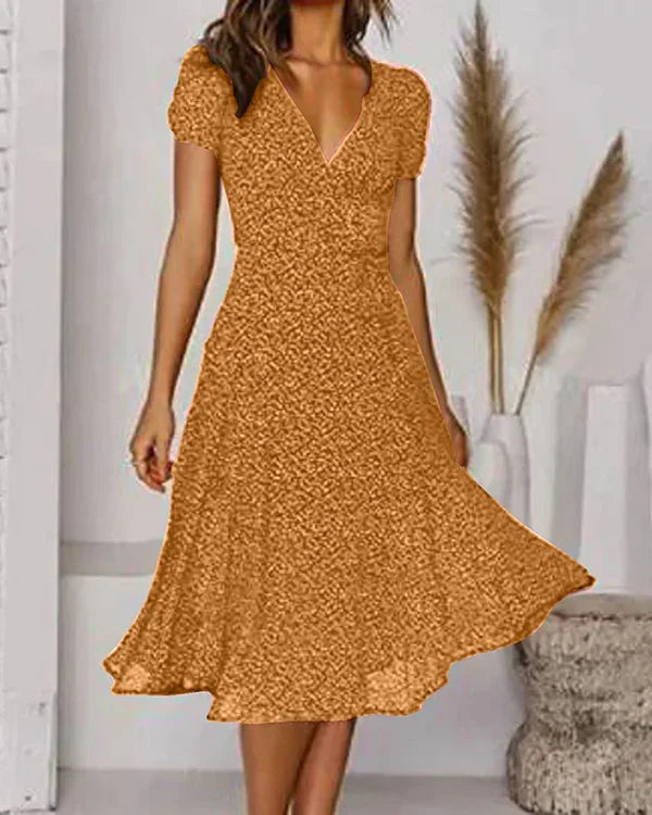 Abito floreale aderente e svasato con scollo a V