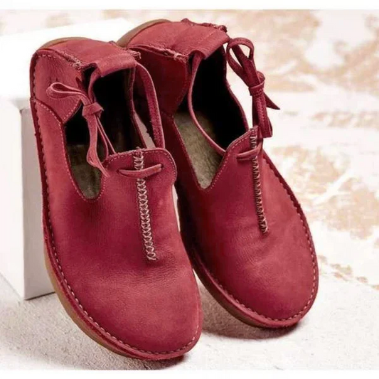 Botines con cremallera y borlas